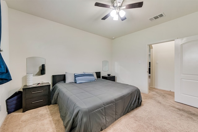 bedroom with ceiling fan and light colored carpet