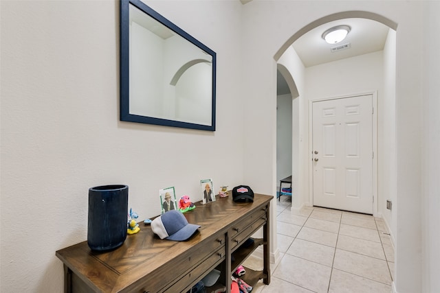 interior space featuring light tile patterned floors