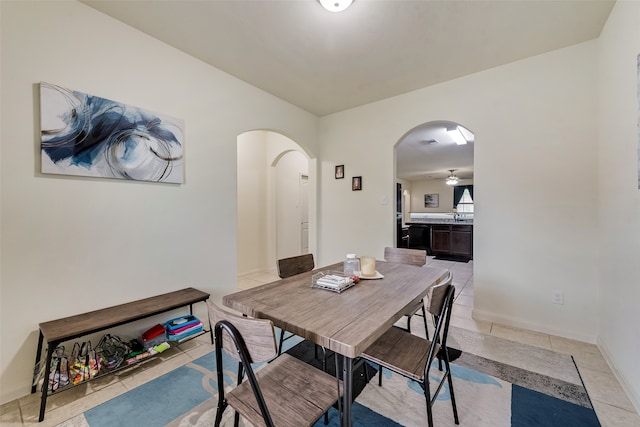 dining area with ceiling fan and light tile patterned floors