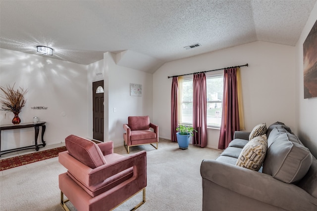 carpeted living room with vaulted ceiling and a textured ceiling