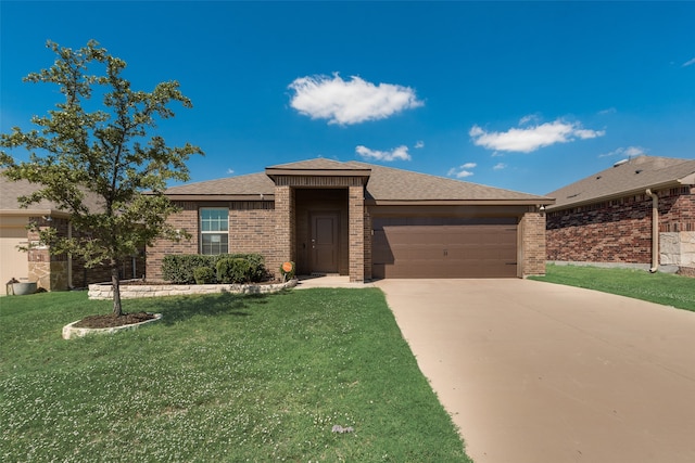 view of front of house featuring a front yard and a garage