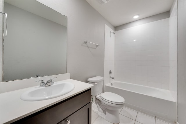 full bathroom with tiled shower / bath, vanity, tile patterned flooring, and toilet