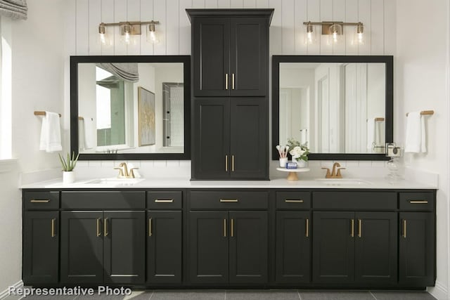 bathroom featuring vanity and backsplash