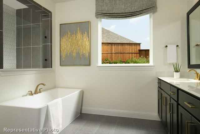 bathroom with vanity, plenty of natural light, separate shower and tub, and tile patterned floors