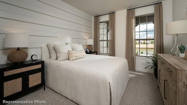 bedroom with light colored carpet