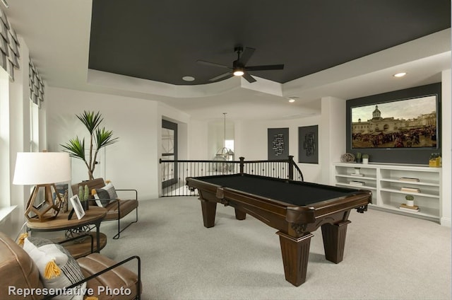 rec room with ceiling fan, a raised ceiling, carpet floors, and billiards