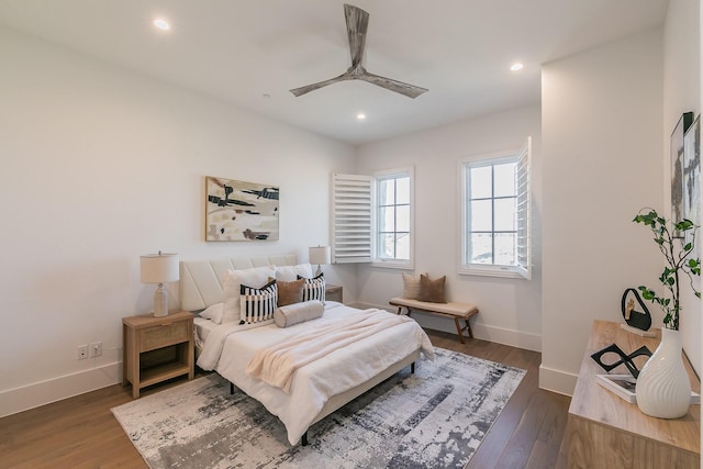 bedroom with recessed lighting, wood finished floors, a ceiling fan, and baseboards