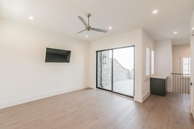 spare room with light wood-style floors, baseboards, a ceiling fan, and recessed lighting