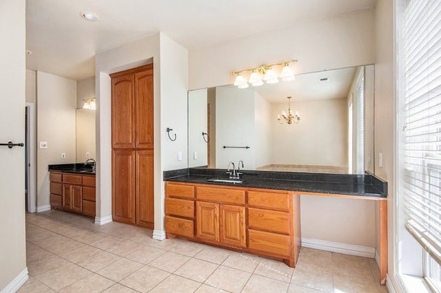 bathroom featuring vanity, a chandelier, and tile patterned flooring