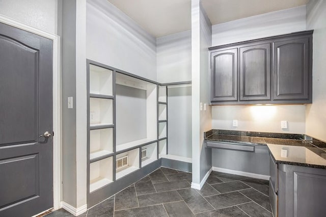 interior space featuring dark tile patterned flooring