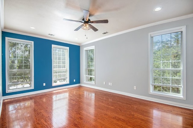 unfurnished room featuring ornamental molding, ceiling fan, and hardwood / wood-style flooring