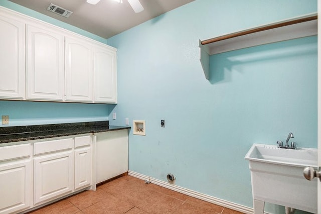 laundry area with ceiling fan, washer hookup, light tile patterned flooring, cabinets, and electric dryer hookup