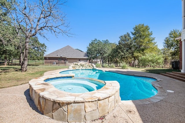 view of swimming pool featuring an in ground hot tub