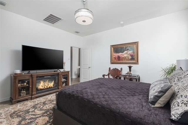 bedroom with wood-type flooring