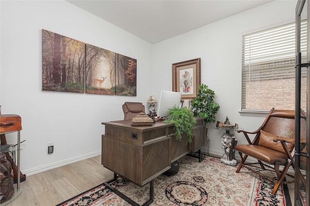 office area with light hardwood / wood-style floors