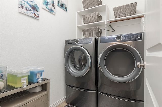 laundry room featuring washing machine and dryer