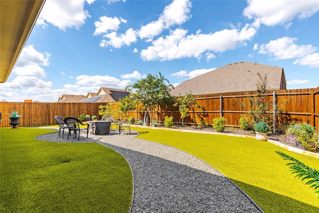 view of yard featuring a patio area and a fire pit