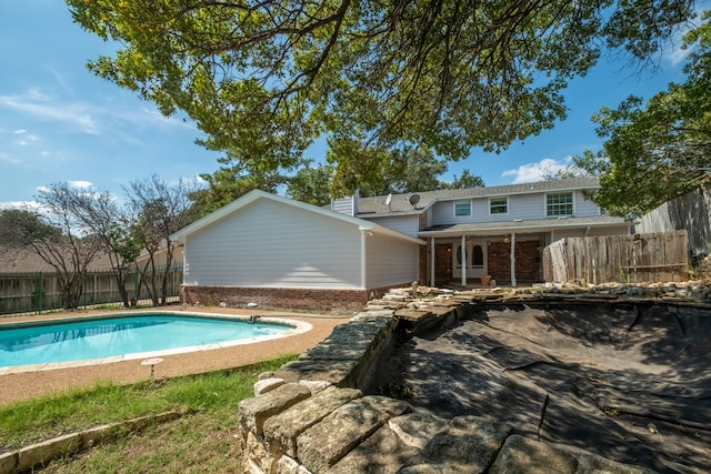 view of swimming pool with a patio area