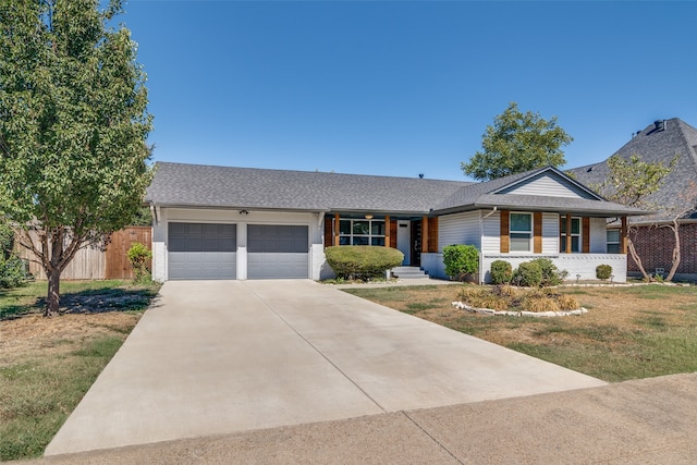 ranch-style house with a front yard, a garage, and a porch