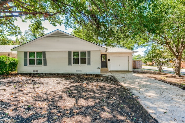 ranch-style home with a garage