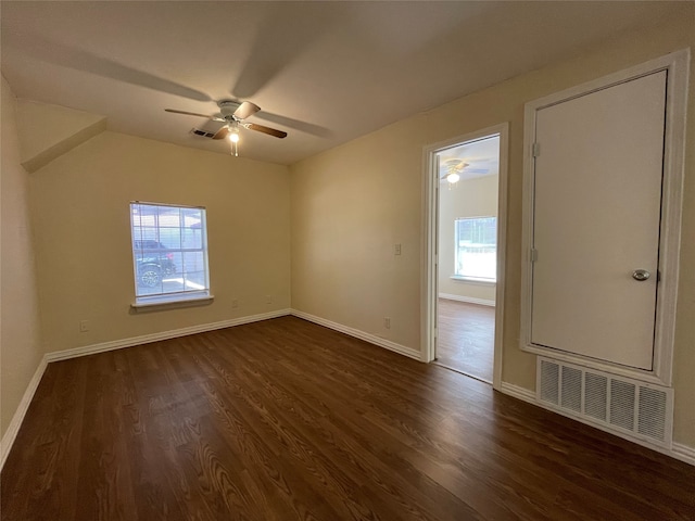 unfurnished room featuring ceiling fan and dark hardwood / wood-style flooring