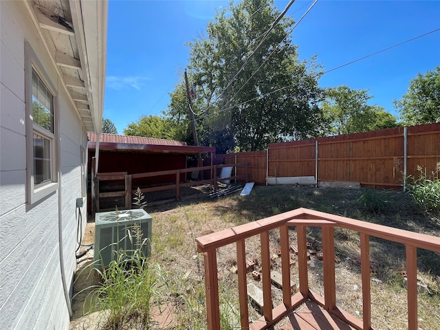 view of yard with central AC