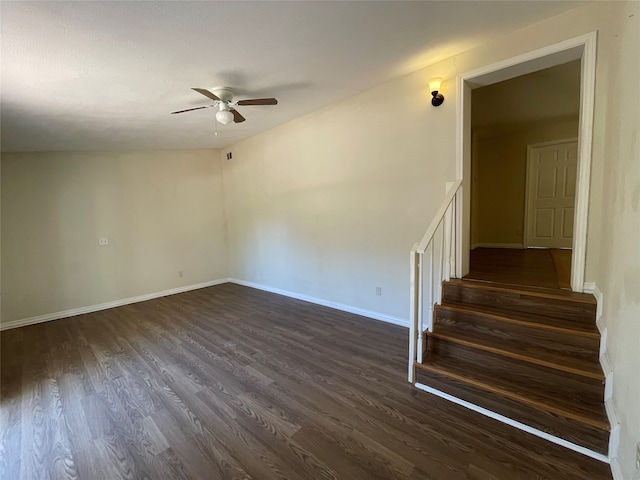 spare room with ceiling fan and dark hardwood / wood-style flooring