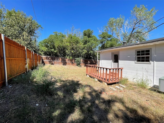 view of yard with a wooden deck