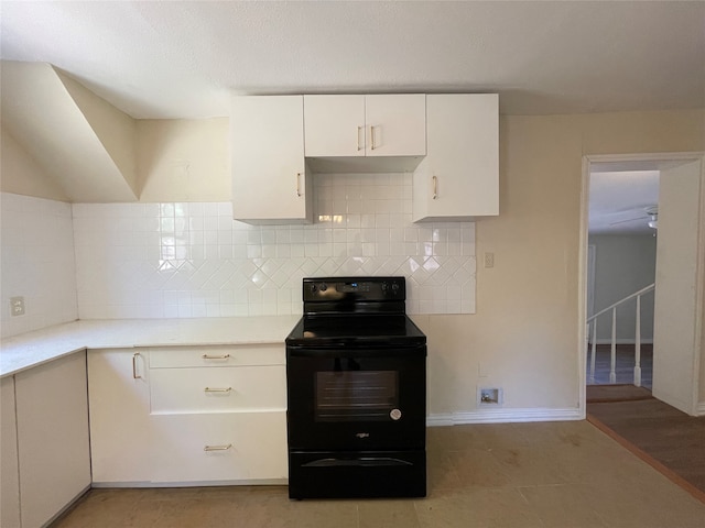 kitchen with black / electric stove, light hardwood / wood-style flooring, white cabinetry, and backsplash