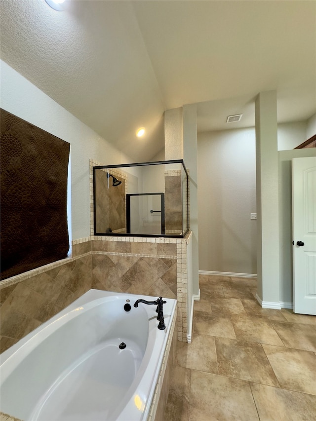 bathroom with shower with separate bathtub