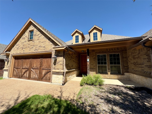 view of front facade with a garage and covered porch