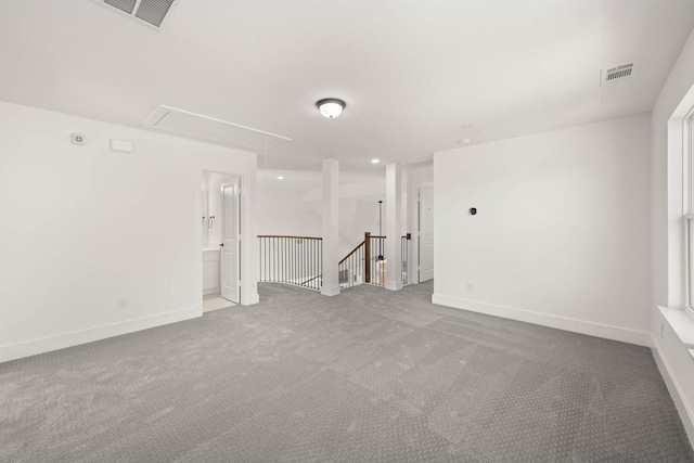 spare room with light colored carpet