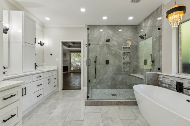 bathroom with hardwood / wood-style flooring, crown molding, vanity, and independent shower and bath