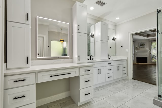 bathroom featuring hardwood / wood-style floors, crown molding, and vanity