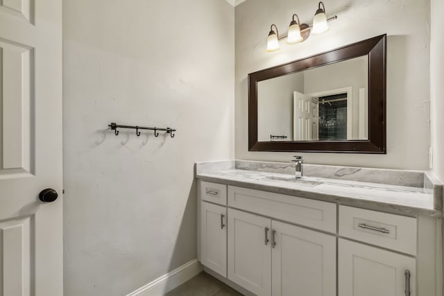 bathroom with tile patterned flooring and vanity