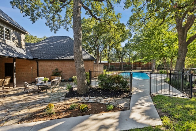 view of pool featuring a patio area