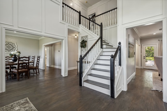 stairway featuring crown molding and hardwood / wood-style flooring