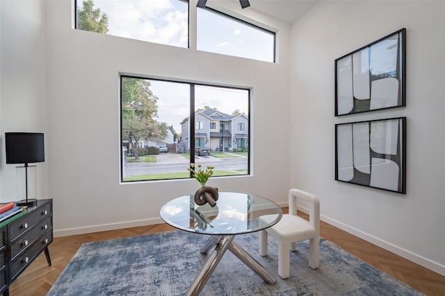 dining area with a high ceiling