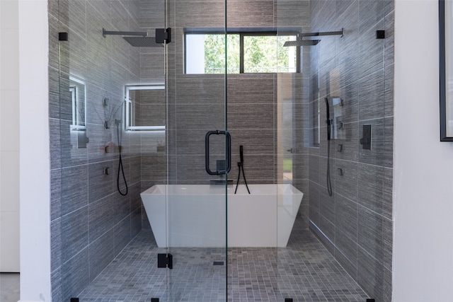 bathroom with shower with separate bathtub