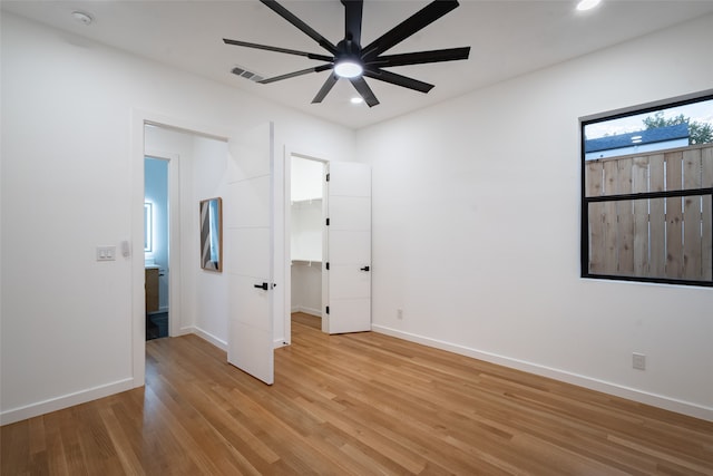 unfurnished bedroom with light wood-type flooring and ceiling fan