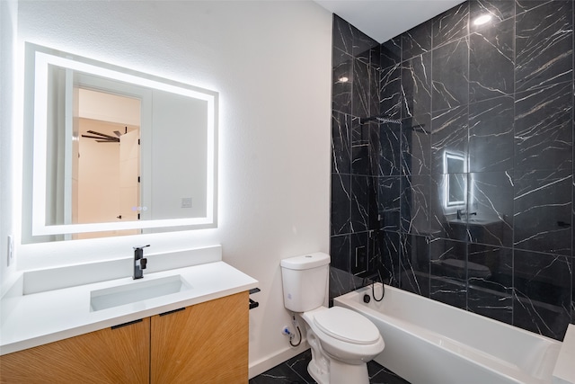 full bathroom featuring vanity, toilet, and tiled shower / bath