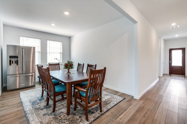 dining room with light hardwood / wood-style floors