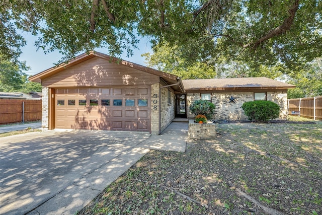 single story home featuring a garage