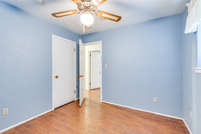 unfurnished room with ceiling fan and light hardwood / wood-style floors