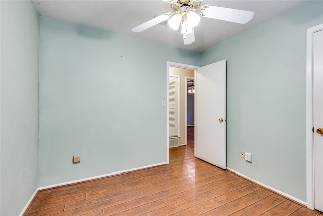 unfurnished room featuring ceiling fan and light hardwood / wood-style flooring