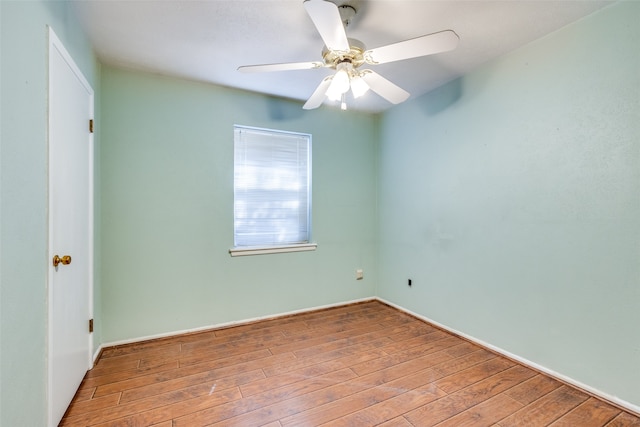 empty room featuring ceiling fan and hardwood / wood-style flooring