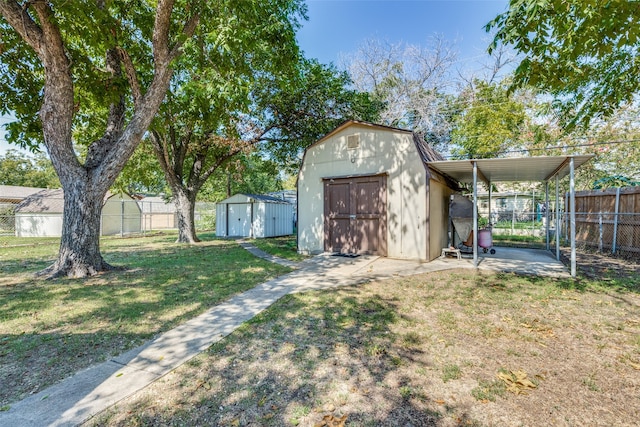 view of yard with a storage unit and a patio area