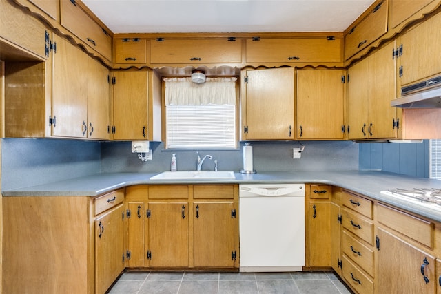 kitchen with light tile patterned floors, backsplash, sink, and white appliances