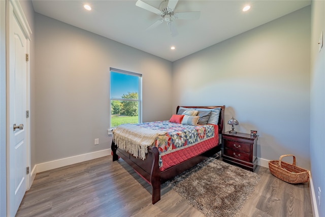 bedroom featuring ceiling fan and hardwood / wood-style flooring