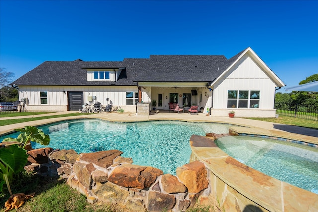 view of pool featuring an in ground hot tub and a patio area